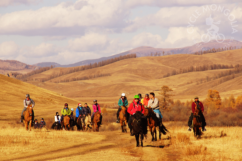 Horse riding excursion through mountain valley
